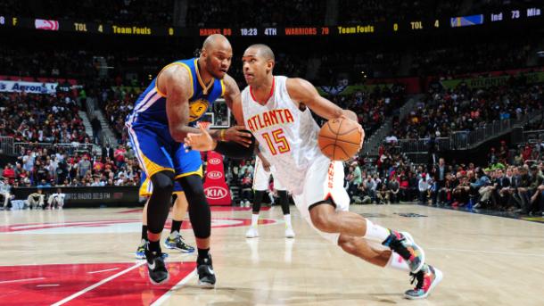 Atlanta's Al Horford goes up against Golden State's Marreese Speights. Scott Cunningham/Getty Images