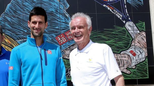 Djokovic poses with Raymond Moore. Credit: Matthew Stockman/Getty Images