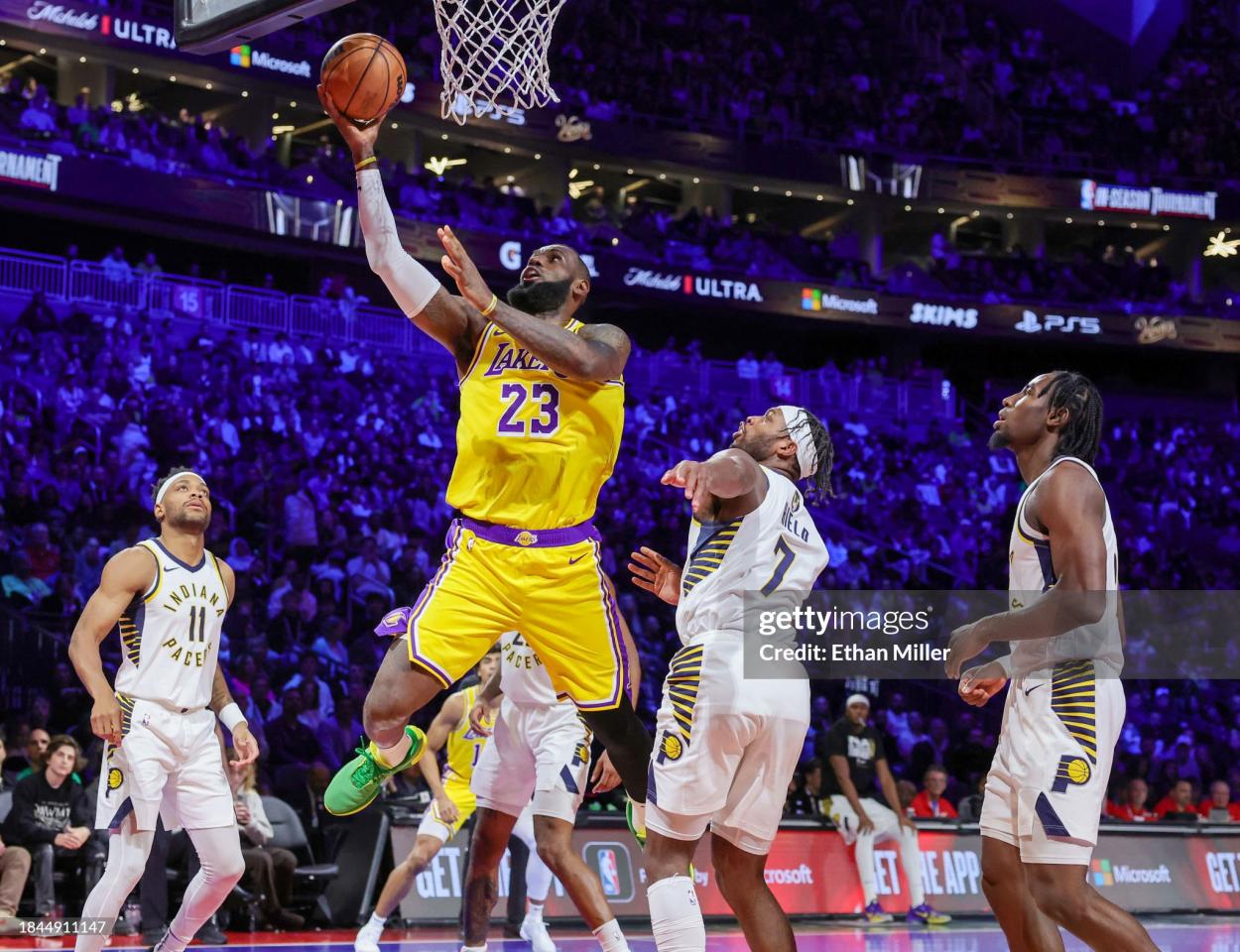 LeBron James #23 of the Los Angeles Lakers shoots a layup against Buddy Hield #7 of the Indiana Pacers in the second quarter of the championship game of the inaugural NBA In-Season Tournament at T-Mobile Arena on December 09, 2023 in Las Vegas, Nevada. The Lakers defeated the Pacers 123-109. NOTE TO USER: User expressly acknowledges and agrees that, by downloading and or using this photograph, User is consenting to the terms and conditions of the Getty Images License Agreement. (Photo by Ethan Miller/Getty Images)