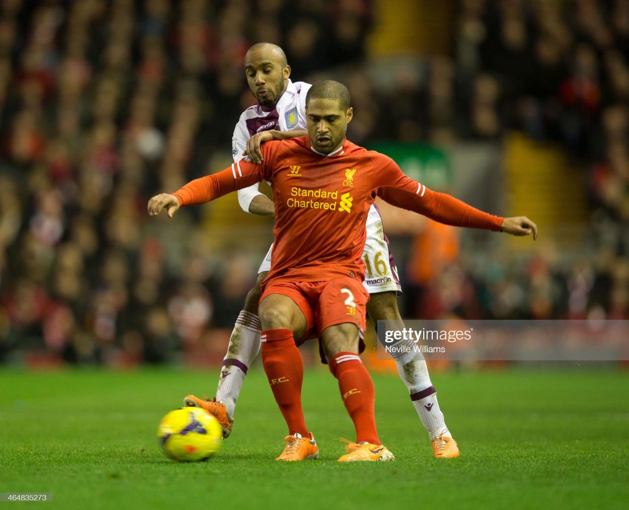 Fabian Delph of Aston Villa is challenged by Glen Johnson of Liverpool during the Barclays <strong><a  data-cke-saved-href='https://www.vavel.com/en/football/2023/05/29/premier-league/1148044-four-things-welearnt-from-aston-villas-win-against-brighton.html' href='https://www.vavel.com/en/football/2023/05/29/premier-league/1148044-four-things-welearnt-from-aston-villas-win-against-brighton.html'>Premier League</a></strong> match between Liverpool and Aston Villa at Anfield on January 18, 2014 in Liverpool, England. (Photo by Neville Williams/Aston Villa FC via Getty Images)