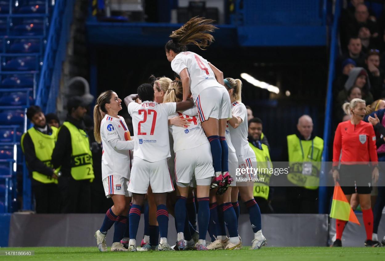 Vanessa Gilles of Olympique Lyonnais (obscured) celebrates with team mates after scoring the team's first goal during the UEFA Women's <strong><a  data-cke-saved-href='https://www.vavel.com/en/football/2023/03/29/womens-football/1142192-arsenal-2-0-bayern-munich-post-match-player-ratings.html' href='https://www.vavel.com/en/football/2023/03/29/womens-football/1142192-arsenal-2-0-bayern-munich-post-match-player-ratings.html'>Champions League</a></strong> quarter-final 2nd leg match between Chelsea FC and Olympique Lyonnais at <strong><a  data-cke-saved-href='https://www.vavel.com/en/football/2023/03/22/womens-football/1141484-emma-hayes-is-satisfied-after-blues-take-the-lead-against-lyon-in-the-first-leg-of-the-champions-league-quarter-finals.html' href='https://www.vavel.com/en/football/2023/03/22/womens-football/1141484-emma-hayes-is-satisfied-after-blues-take-the-lead-against-lyon-in-the-first-leg-of-the-champions-league-quarter-finals.html'>Stamford Bridge</a></strong> on March 30, 2023 in London, England. (Photo by Mike Hewitt/Getty Images)