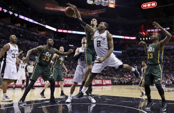 Will Kawhi Leonard win the Defensive PLayer of the Year for the third straight year or will Rudy Gobert anchor in his defense and block his attempt in winning three-in-a-row? Photo: Edward A. Ornelas /San Antonio Express-News