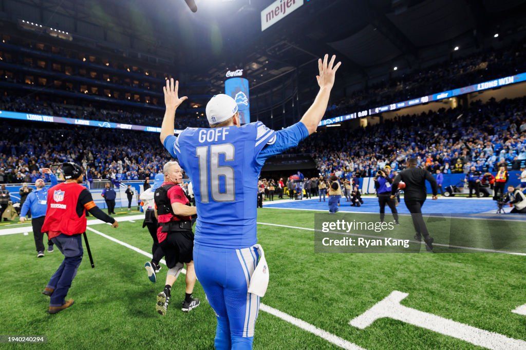 DETROIT, MICHIGAN - JANUARY 14: Jared Goff #16 of the Detroit Lions waves to the fans and crowd as he runs off the field after an NFC Wild Card Playoff football game against the Los Angeles Rams at Ford Field on January 14, 2024 in Detroit, Michigan. (Photo by Ryan Kang/Getty Images)