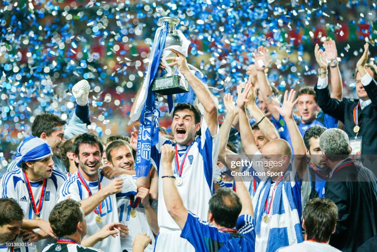Trainos Dellas of Greece celebrates with team mates during the Euro final match between Portugal and Greece at Estadio da Luz in Lisbon, Portugal on July 4th, 2004. (Photo by Alain Gadoffre / Onze / Icon Sport via Getty Images)