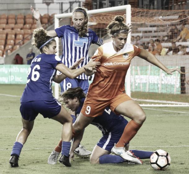 Houston Dash forward Sarah Hagen (9) is defensed by three Boston Breakers players during the second half of the game at BBVA Compass Stadium Saturday, July 22, 2017, in Houston. Houston Dash defeated Boston Breakers 1-0. | Photo: Yi-Chin Lee / Houston Chronicle