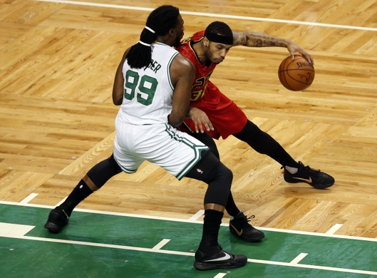 Hawks forward Mike Scott posts up against Celtics forward Jae Crowder 