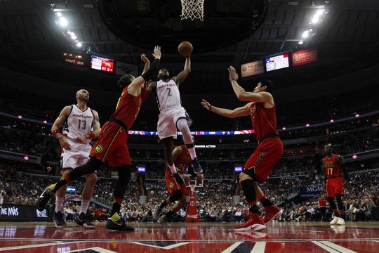 Washington Wizards guard John Wall (2) dunks the ball against Atlanta Hawks forward Mike Muscala (31). Photo by:Geoff Burke-USA TODAY Sports