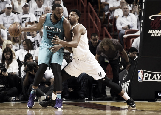 Charlotte Hornets Center Al Jefferson posts up against Miami Heat Center Hassan Whiteside.