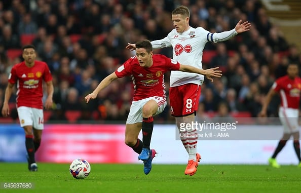 Ander Herrera shrugs Steven Davies off the ball on Sunday