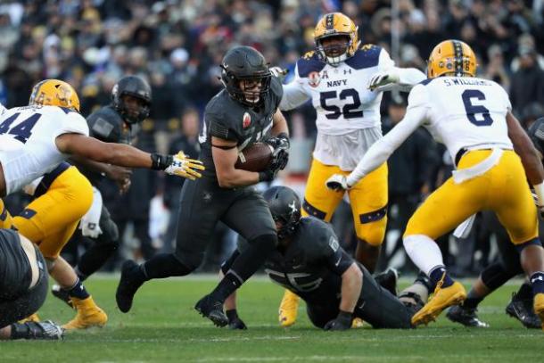 The Navy Midshipmen defend the rush against the Army Black Knights at M&T Bank Stadium in Baltimore/Getty Images