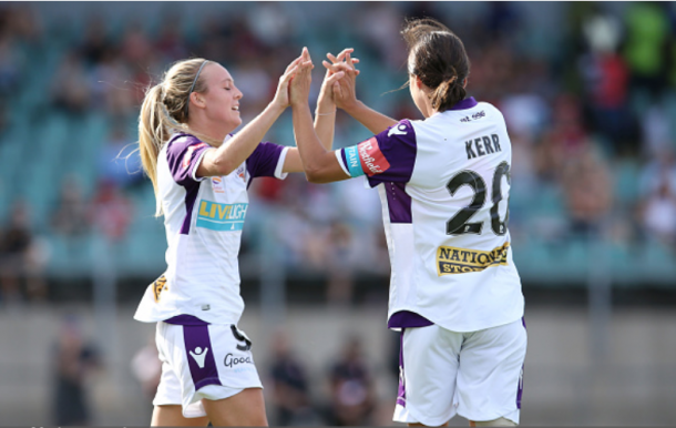 Rachel Hill (left) celebrates with Sam Kerr after they combined for a goal. The pair has accounted for 12 goals in six games for Perth this season. | Photo: Jason McCawley - Getty Images
