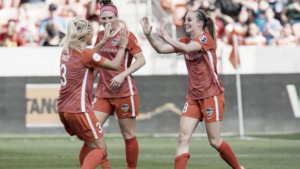 Rachel Daly congratulating Kimberly Keever after a goal during the season opener against the Chicago Red Stars |  Photo: Wilf Thorne/isiphotos.com