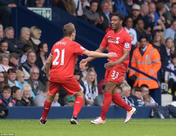 Lucas and Ibe celebrate the equaliser (photo; Reuters)