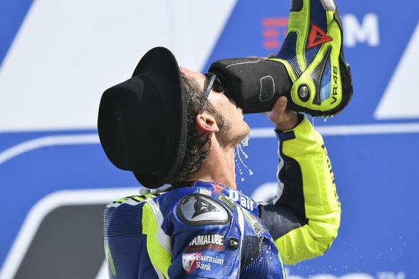 Rossi celebrating on the podium in front of his home fans drinking champagne from his shoe! - www.valentinorossi.com