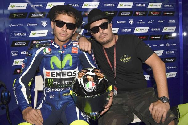 Rossi and Ucio posing with the special Blue's Brothers helmet design for the Italian's home GP - www.valentinorossi.com