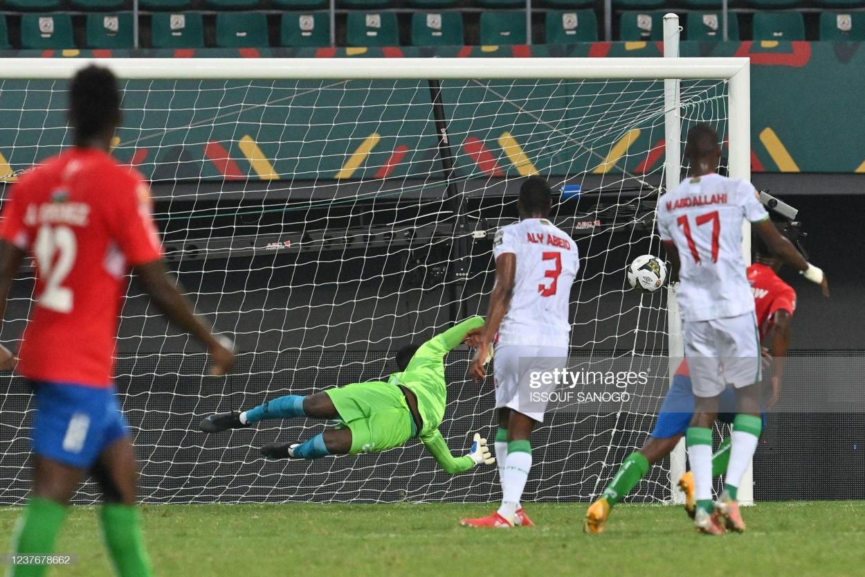 Gambia's midfielder Ablie Jallow (backR) reacts after scoring his team's first goal during the Group F Africa Cup of Nations (CAN) 2021 football match between Mauritania and Gambia at Limbe Omnisport Stadium in Limbe on January 12, 2022. (Photo by Issouf SANOGO / AFP) (Photo by ISSOUF SANOGO/AFP via Getty Images)