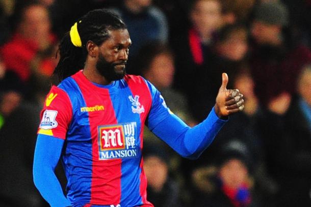 Emmanuel Adebayor, sporting a yellow hairband, failed to equalise with a golden chance in injury time