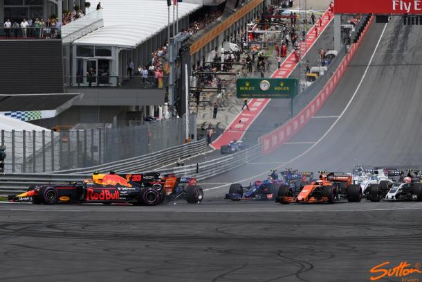 Verstappen, on the outside, is taken out by Alonso, who was taken out by Kvyat. (Image Credit: Sutton Images)