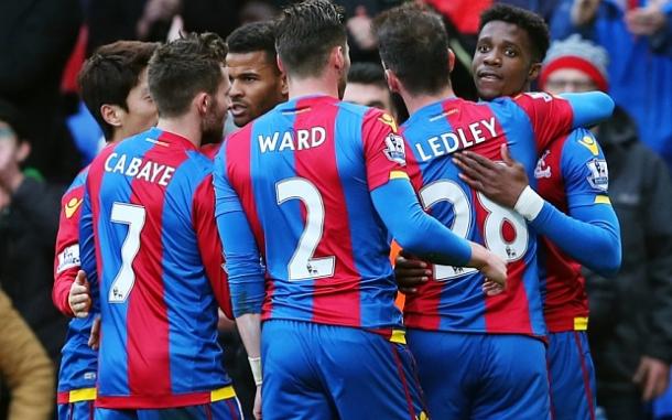 Zaha is congratulated on his goal by his teammates | Photo: Getty images