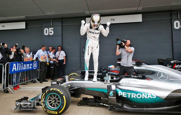 Lewis Hamilton celebrates his fourth British GP win, and third in a row. (Image Credit: www.carsuk.com)