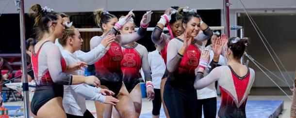 NC State celebrates a hit bar routine against Florida in Raleigh/NC State Athletics