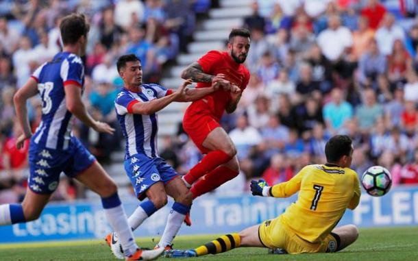 Ings puts the ball past Nicholls for Liverpool's first goal against Wigan (photo: Getty Images)