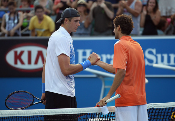 Isner and Cilic shake hands at the net folowing the conclusion of their five set battle at the Australian Open in 2011 (Photo by Julian Finney / Getty Images)