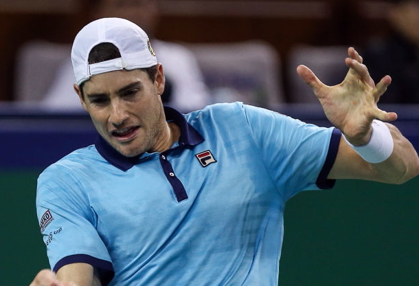Photo Source: Yifan Ding/Getty Images-John Isner's forehand keeps him in the match.