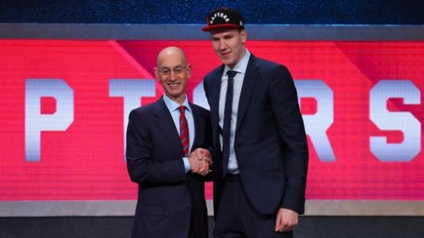 Jakob Poeltl picked in the first round, pick 9. He is seen shaking NBA Commissioner Adam Silver on Draft Day. Photo: Mike Stobe/Getty Images 