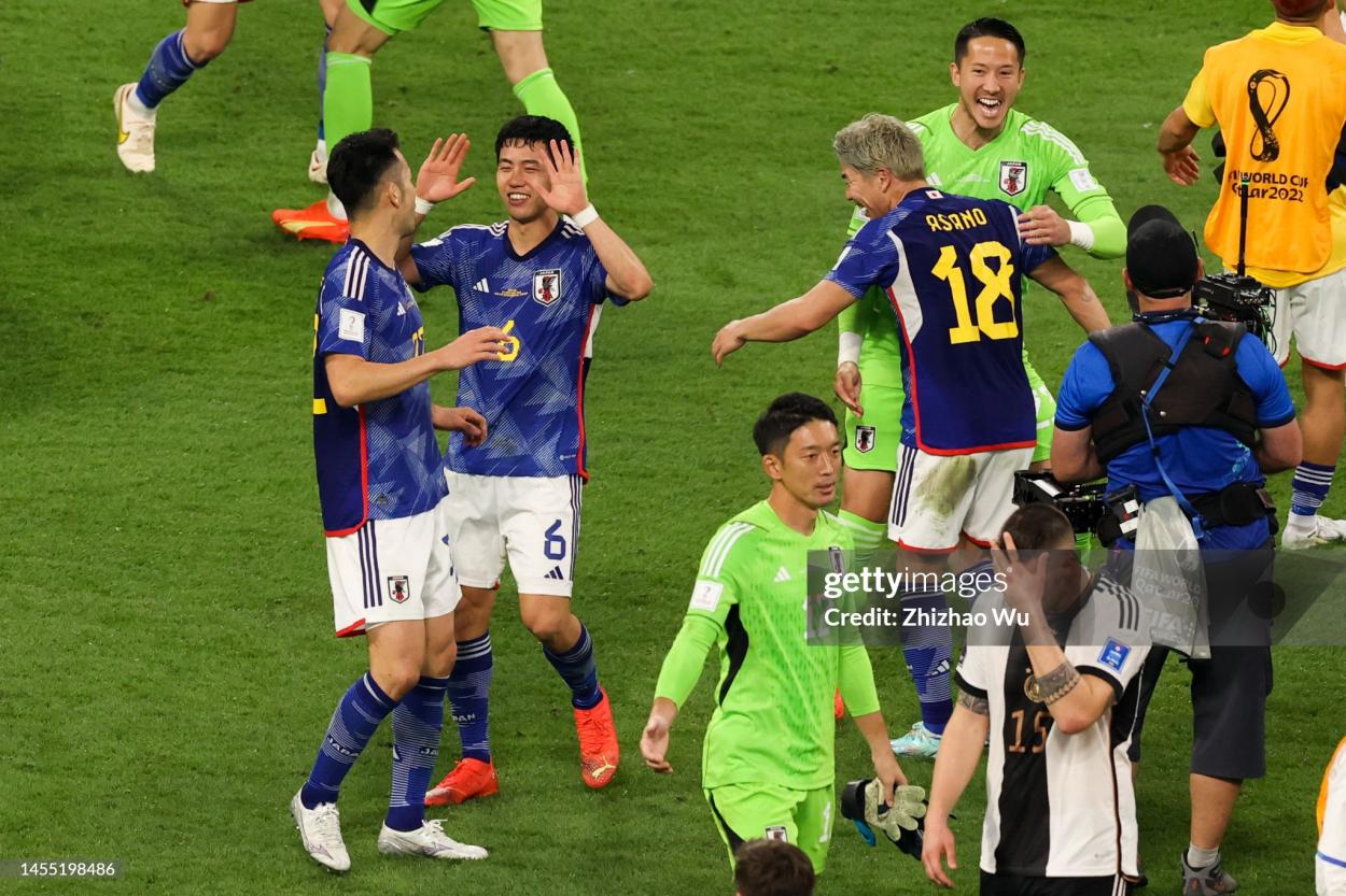 Players of Japan celebrate the victory after the FIFA World Cup Qatar 2022 Group E match between Germany and Japan at Khalifa International Stadium on November 23, 2022 in Doha, Qatar. (Photo by Zhizhao Wu/Getty Images)
