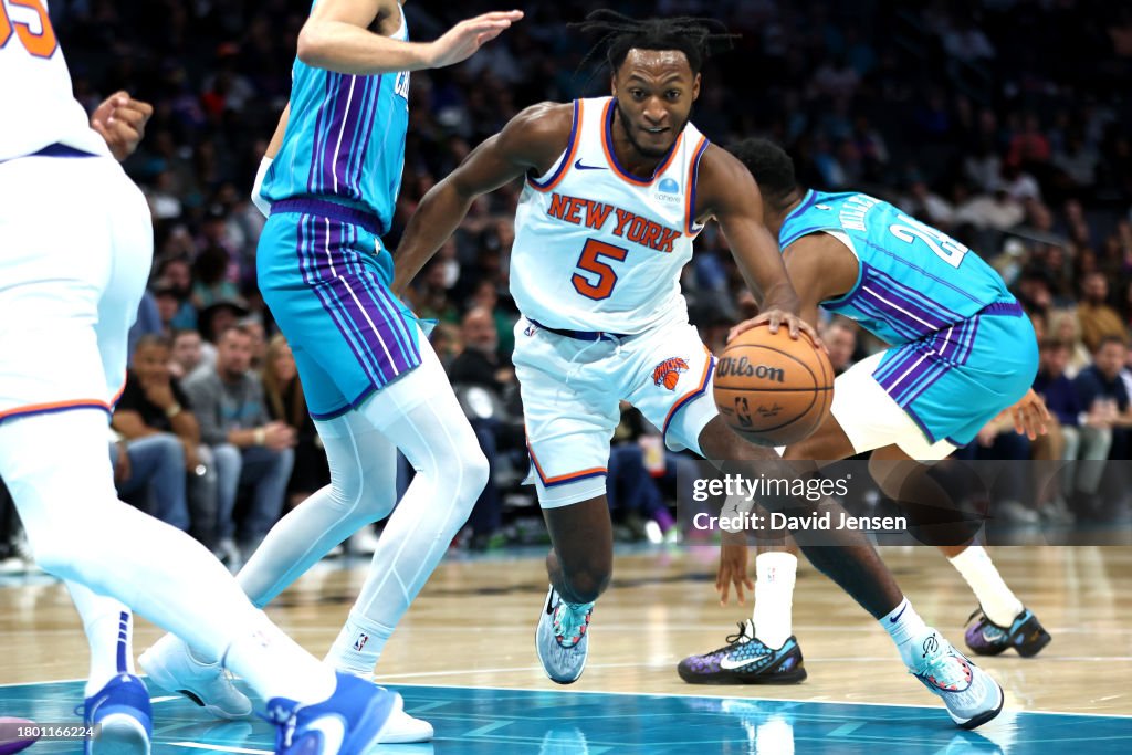 Immanuel Quickley #5 of the New York Knicks drives to the basket during the first half of an NBA game against the Charlotte Hornets at Spectrum Center on November 18, 2023 in Charlotte, North Carolina. NOTE TO USER: User expressly acknowledges and agrees that, by downloading and or using this photograph, User is consenting to the terms and conditions of the Getty Images License Agreement. (Photo by David Jensen/Getty Images)