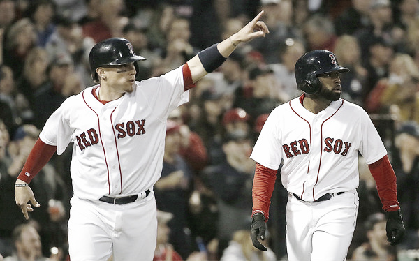 Christian Vazquez (left) and Jackie Bradley Jr. (right) react after Mookie Betts' double, scoring both runners. (Source: Jim Rogash/Getty Images North America)