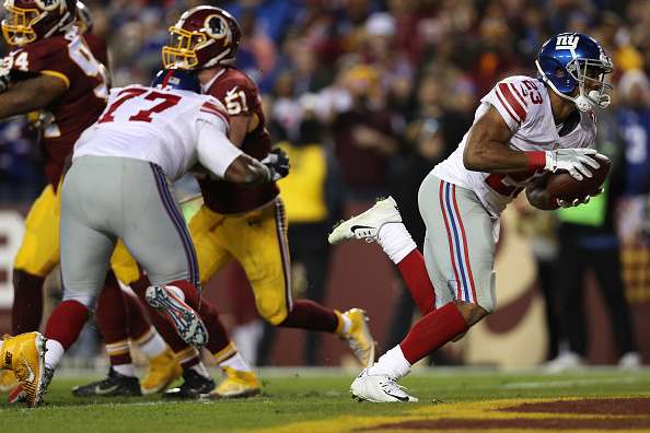 New York Giants running back Rashad Jennings scores a second quarter touchdown against the Washington Redskins(Photo by Patrick Smith/Getty Images)