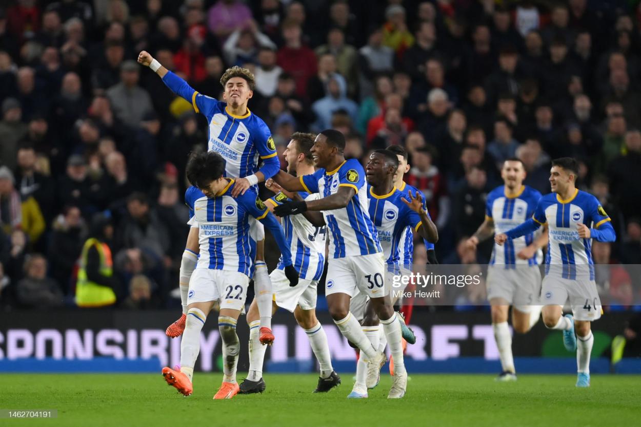 Brighton players wheel away in celebration (Photo by Mike Hewitt/Getty Images)