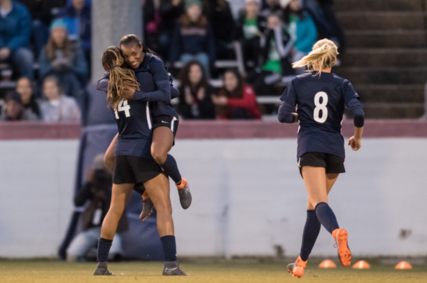 Forward Jess McDonald (14) celebrates with Crystal Dunn in their first match together during the 2018 preseason. | Photo: @J_Mac1422