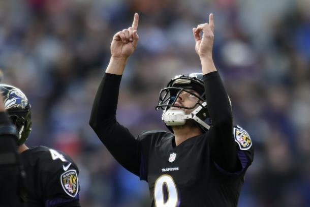 Tucker points to the sky after one of his field goals against the Bengals. (Source: Gail Burton/AP)