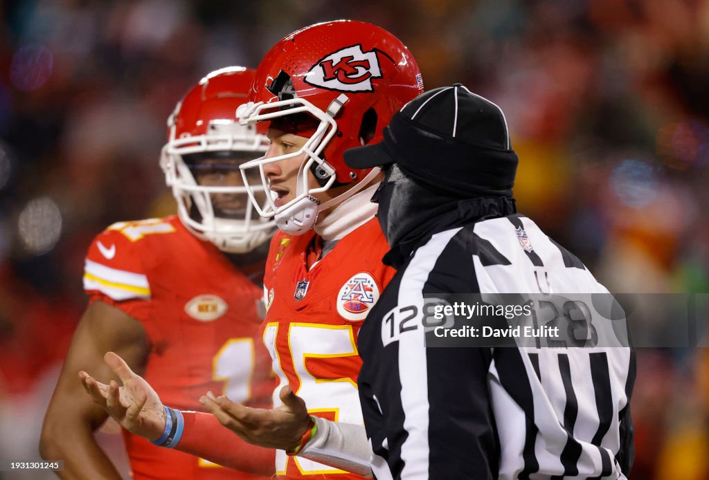 Patrick Mahomes #15 of the Kansas City Chiefs heads to the sideline after his helmet was cracked during the third quarter in the AFC Wild Card Playoffs against the Miami Dolphins at GEHA Field at Arrowhead Stadium on January 13, 2024 in Kansas City, Missouri. (Photo by David Eulitt/Getty Images)
