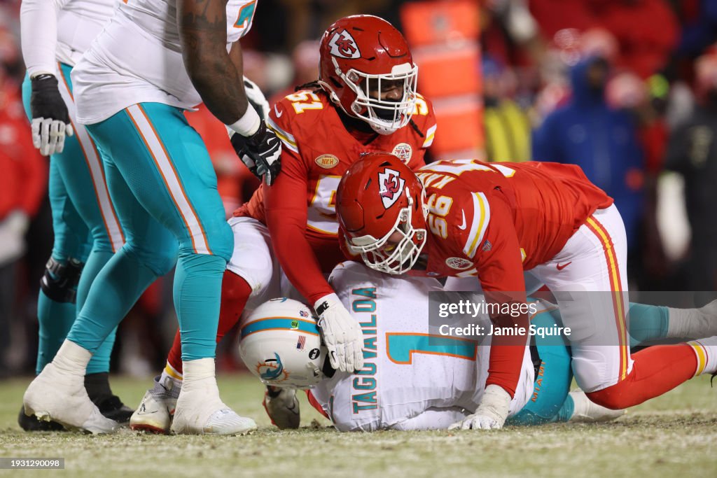George Karlaftis #56 of the Kansas City Chiefs sacks Tua Tagovailoa #1 of the Miami Dolphins during the second quarter in the AFC Wild Card Playoffs at GEHA Field at Arrowhead Stadium on January 13, 2024 in Kansas City, Missouri. (Photo by Jamie Squire/Getty Images)