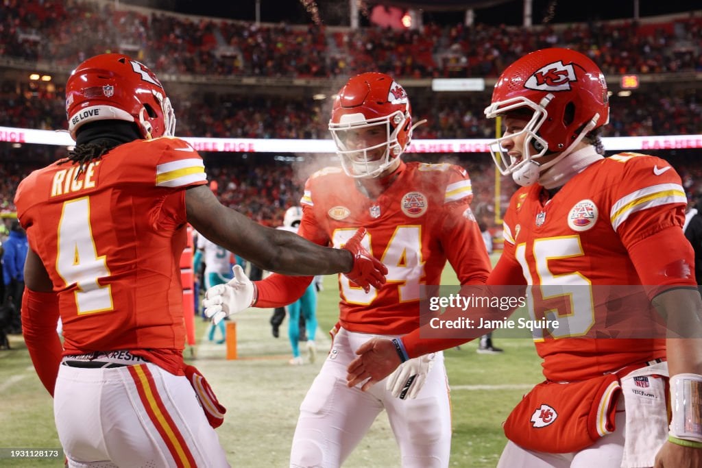  Rashee Rice #4 of the Kansas City Chiefs celebrates with Justin Watson #84 and <strong><a  data-cke-saved-href='https://www.vavel.com/en-us/nfl/2023/11/21/1163735-nfl-kansas-city-chiefs-17-21-philadelphia-eagles.html' href='https://www.vavel.com/en-us/nfl/2023/11/21/1163735-nfl-kansas-city-chiefs-17-21-philadelphia-eagles.html'>Patrick Mahomes</a></strong> #15 after scoring a touchdown during the first quarter against the Miami Dolphins in the AFC Wild Card Playoffs at GEHA Field at Arrowhead Stadium on January 13, 2024 in Kansas City, Missouri. (Photo by Jamie Squire/Getty Images)