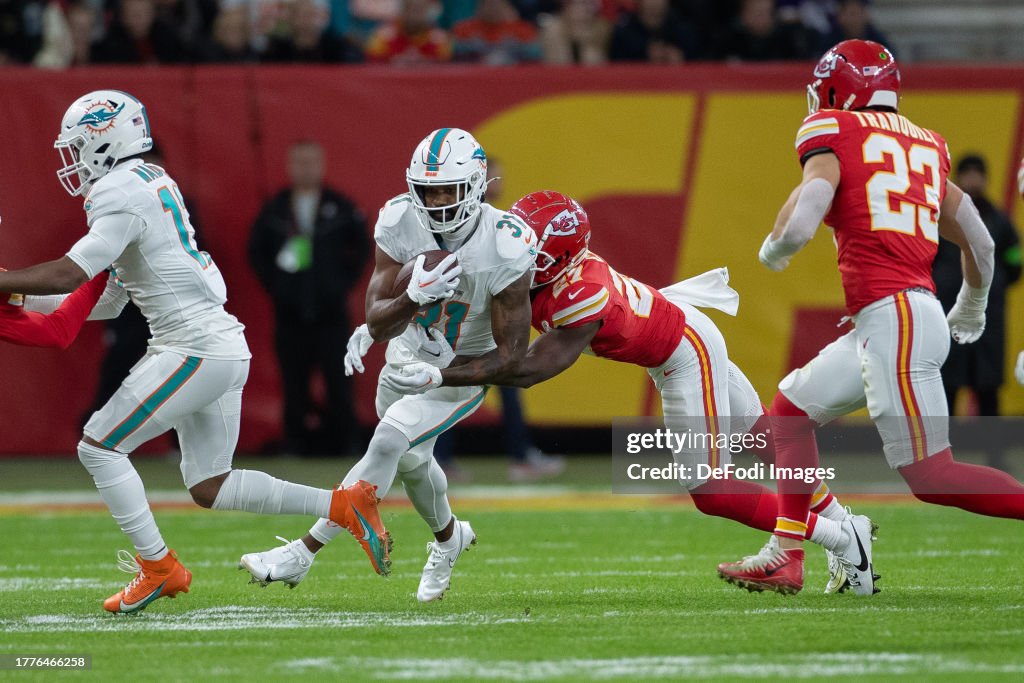 Raheem Mostert of Miami Dolphins and Nikko Remigio of Kansas City Chiefs battle for the ball during the NFL match between Miami Dolphins and Kansas City Chiefs at Deutsche Bank Park on November 5, 2023 in Frankfurt am Main, Germany. (Photo by Mario Hommes/DeFodi Images via Getty Images)
