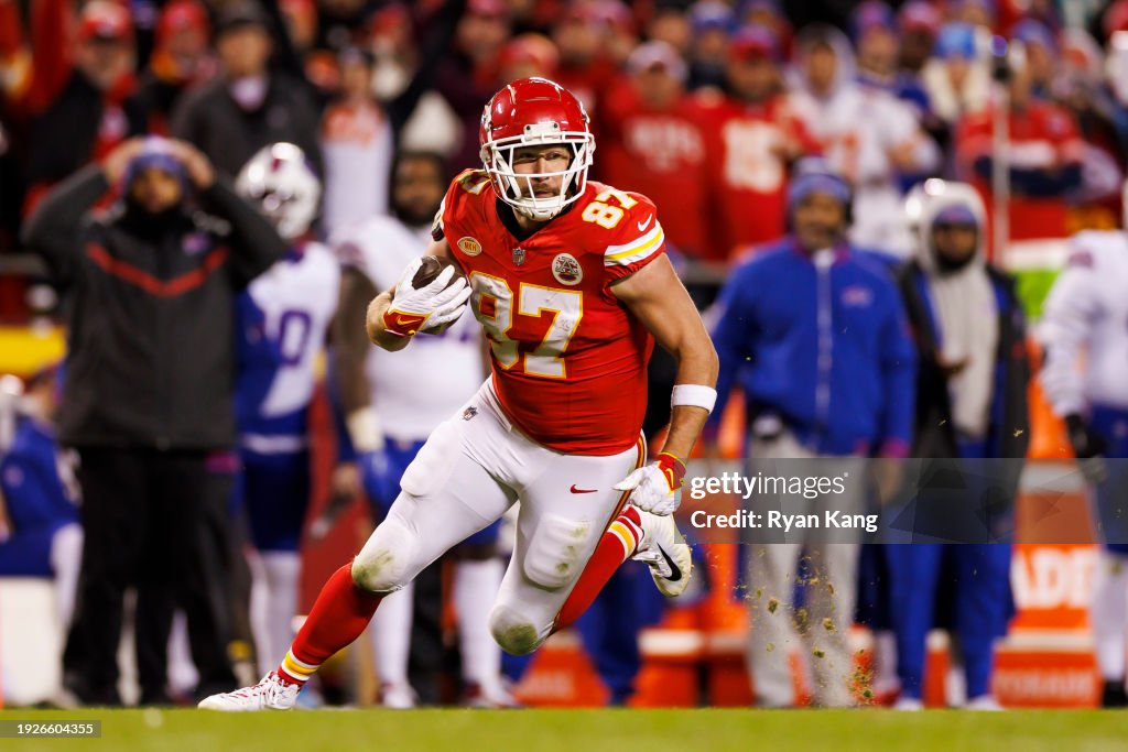 Travis Kelce #87 of the Kansas City Chiefs runs the ball after a catch during an NFL football game against the Buffalo Bills at GEHA Field at Arrowhead Stadium on December 10, 2023 in Kansas City, Missouri. (Photo by Ryan Kang/Getty Images)