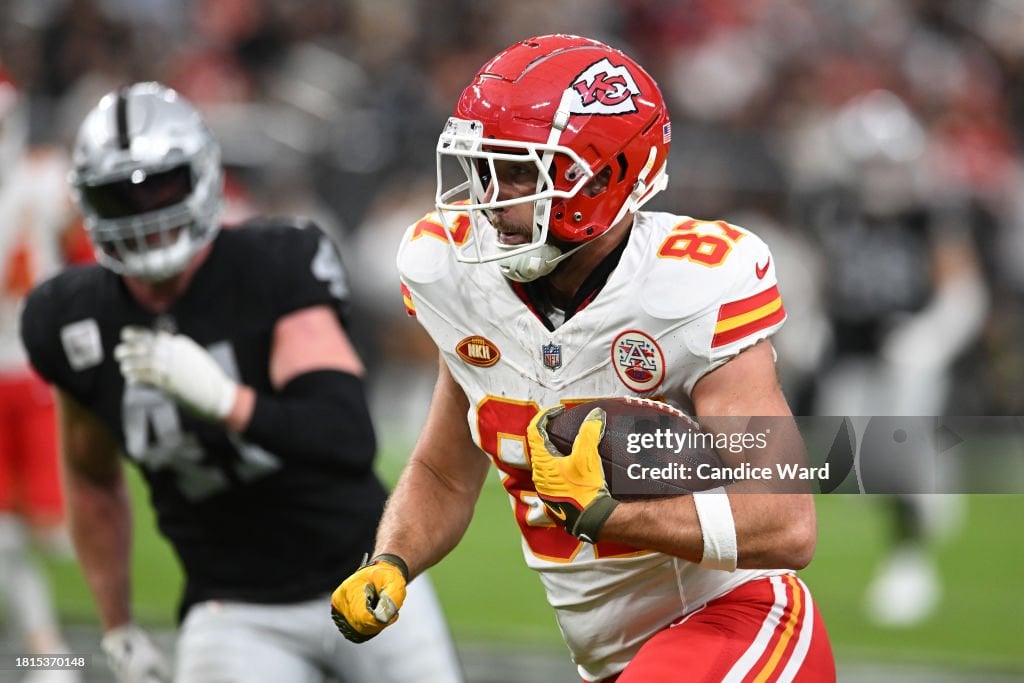 <strong><a  data-cke-saved-href='https://www.vavel.com/en-us/nfl/2024/01/14/1168659-kansas-city-chiefs-26-7-miami-dolphins-ice-cold-chiefs-pick-up-the-win.html' href='https://www.vavel.com/en-us/nfl/2024/01/14/1168659-kansas-city-chiefs-26-7-miami-dolphins-ice-cold-chiefs-pick-up-the-win.html'>Travis Kelce</a></strong> #87 of the Kansas City Chiefs runs with the ball during the second quarter against the Las Vegas Raiders at Allegiant Stadium on November 26, 2023 in Las Vegas, Nevada. (Photo by Candice Ward/Getty Images)