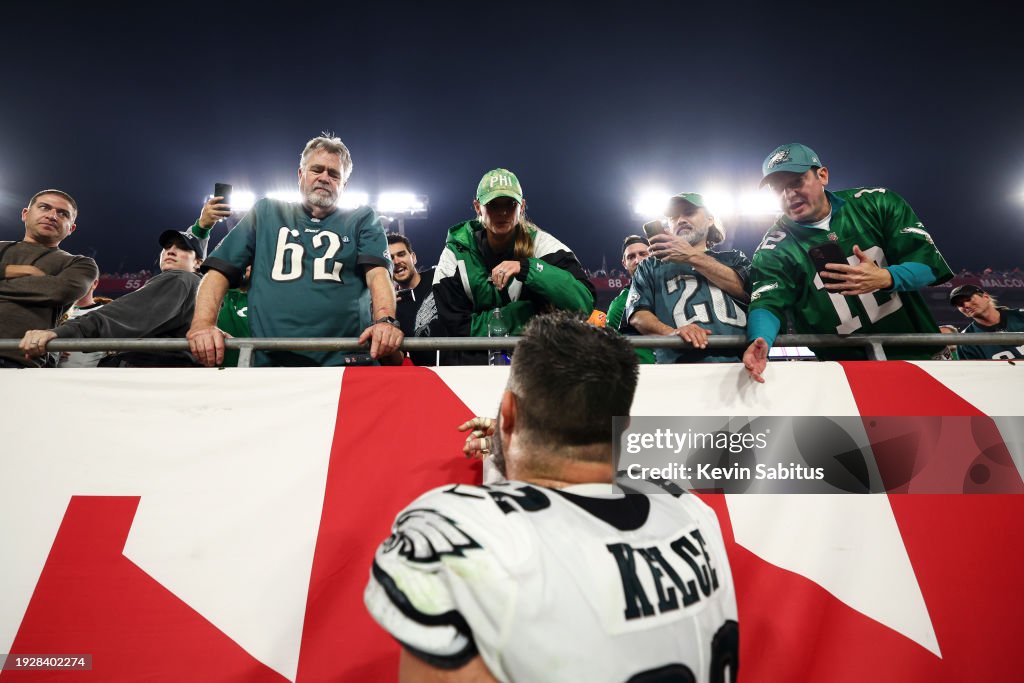 Jason Kelce #62 of the Philadelphia Eagles talks with his family in the stands after an NFL wild-card playoff football game against the Tampa Bay Buccaneers at Raymond James Stadium on January 15, 2024 in Tampa, Florida. (Photo by Kevin Sabitus/Getty Images)