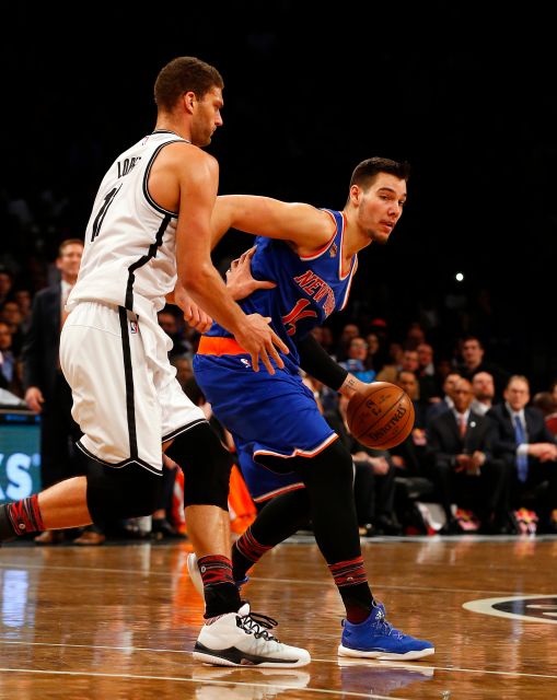 New York Knicks center Willy Hernangomez (14) holds the ball against Brooklyn Nets center Brook Lopez (11). Photo courtesy of Jim McIsaac, Newsday. 