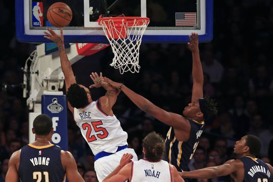 New York Knicks point guard Derrick Rose a (25) attacks the basket past Indiana Pacers center Myles Turner (33). Photo Courtesy of  Adam Hunger-USA TODAY Sports.