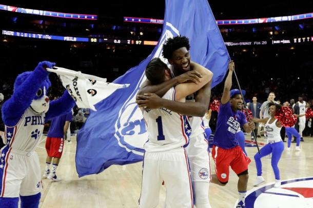 Philadelphia Sixers Joel Embiid and T.J. McConnell celebrate their victory. Photo courtesy of Matt Slocum/Associated Press.