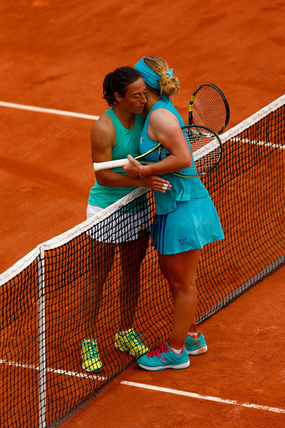 Kuznetsova and Schiavone embrace at the net following their second round encounter at the French Open in 2015 (Photo by Julian Finney / Getty Images)
