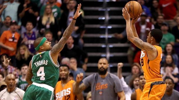 Suns point guard Tyler Ulis pulls up for the game-winning three-point shot over Celtics point guard Isaiah Thomas (Christian Petersen / Getty Images)
