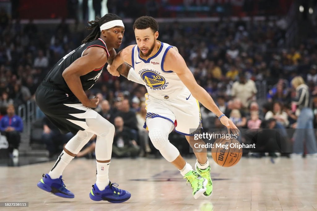 Stephen Curry #30 of the <strong><a  data-cke-saved-href='https://www.vavel.com/en-us/nba/2023/10/20/1159832-top-5-nba-western-conference-ring-contenders.html' href='https://www.vavel.com/en-us/nba/2023/10/20/1159832-top-5-nba-western-conference-ring-contenders.html'>Golden State</a></strong> Warriors handles the ball defended by Terance Mann #14 of the LA Clippers in the first quarter at Crypto.com Arena on December 02, 2023 in Los Angeles, California. NOTE TO USER: User expressly acknowledges and agrees that, by downloading and or using this photograph, User is consenting to the terms and conditions of the Getty Images License Agreement. (Photo by Meg Oliphant/Getty Images)