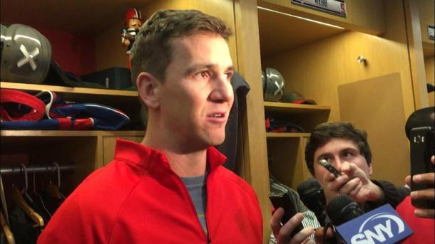 Manning stands at his locker to field questions after his stunning benching/Photo: Pat Leonard/New York Daily News